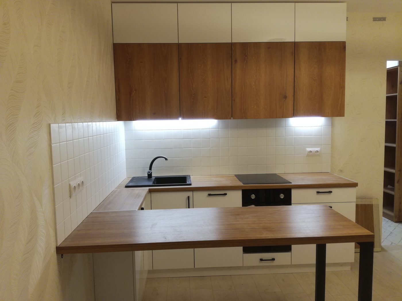Modern white kitchen with wood bar