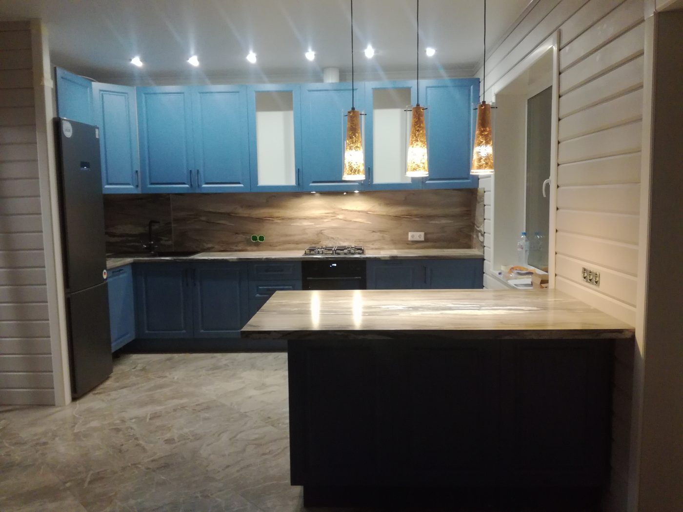 Blue kitchen installation by The Doska